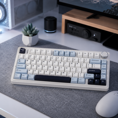 retro style keyboard in the F75 series sits on a desk with a mouse, plant and computer monitor