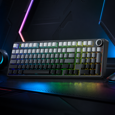 RGB gaming keyboard displayed on a modern gaming desk with colorful backlighting and a premium desktop setup.