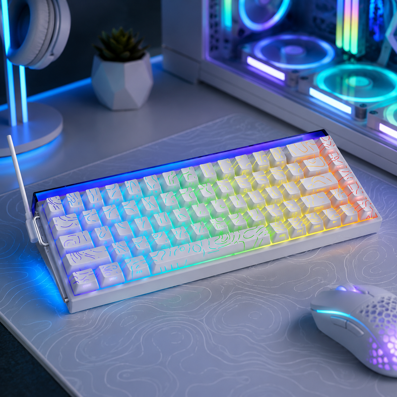 Gaming keyboard with RGB lighting on a desk with a computer setup in the background